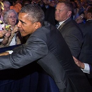 Official photo from the same event, June 9, 2015: President Obama greets audience members after his remarks on health care reform. Photo by Pete Souza, public domain. It is not a frame of the clipped video.
