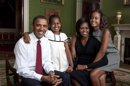 Verified real photograph: a family portrait of Barack Obama, Michelle Obama and their daughters seated in the Green Room of the White House, September 1, 2009.