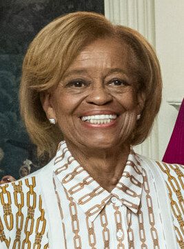 Verified real photograph: Marian Robinson, Michelle Obama’s mother, smiling, cropped from a White House photograph taken September 7, 2022.